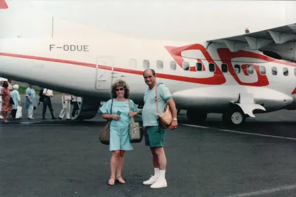 Mario R. Alvarez, Sr. beside a small passenger plane